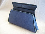 Handmade Sapphire Blue Stingray Clutch Bag. Bkack Kangaroo Lining With Inside Alligator Pocket.  Black Doe Kid Leather Hand Braiding.  Magnetic Closure.  PHD Logo ID Tag. (Front View)